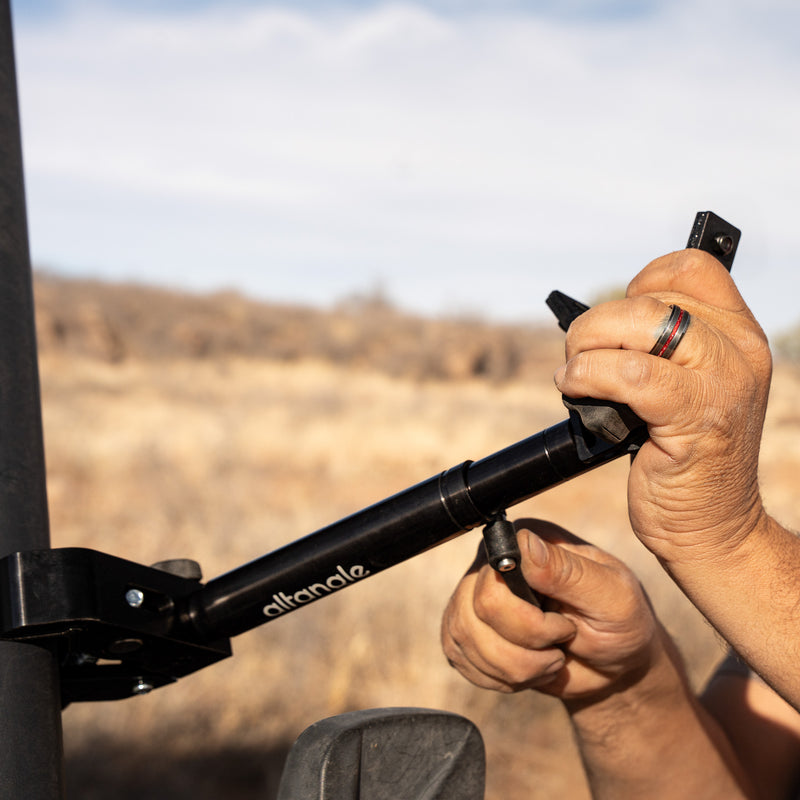 Hand on the secondary lockout handle, securing the bracket in place