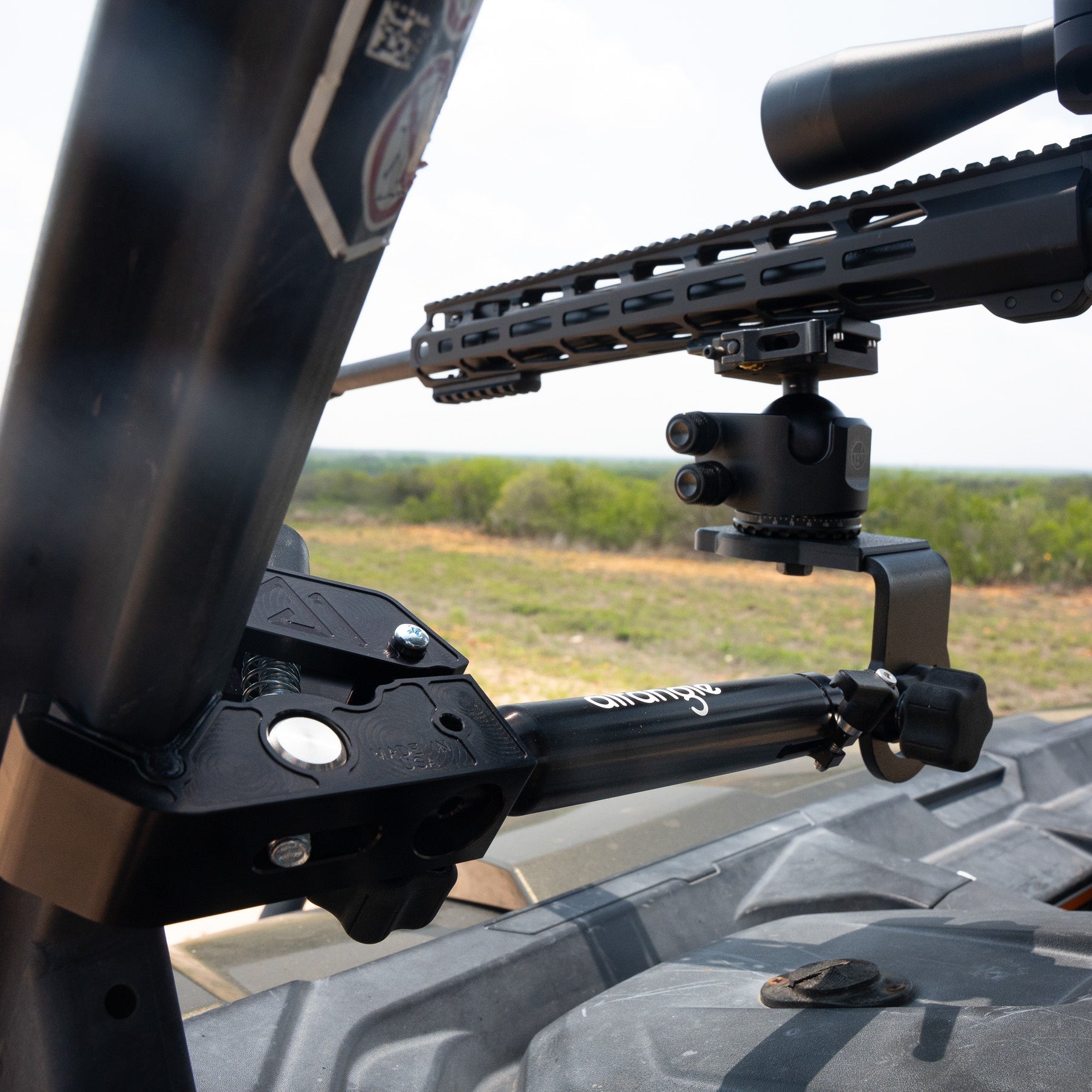 Close-up of the Connect Hub clamped to a side-by-side roll cage with a ballhead mounted
