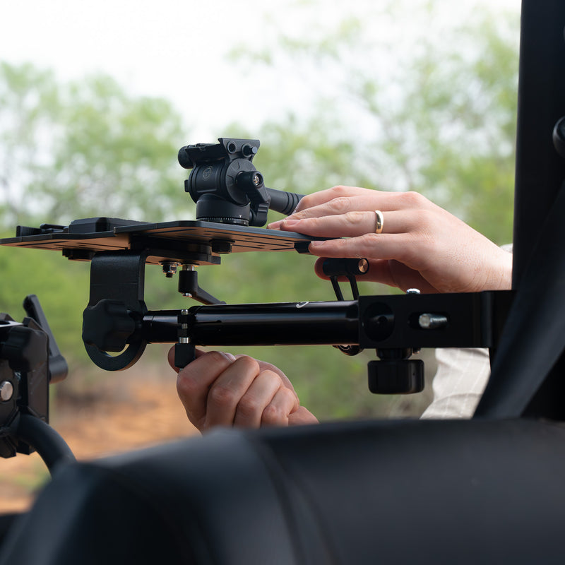 Tight crop of Hub clamped to a UTV cage with ballhead and rifle in frame