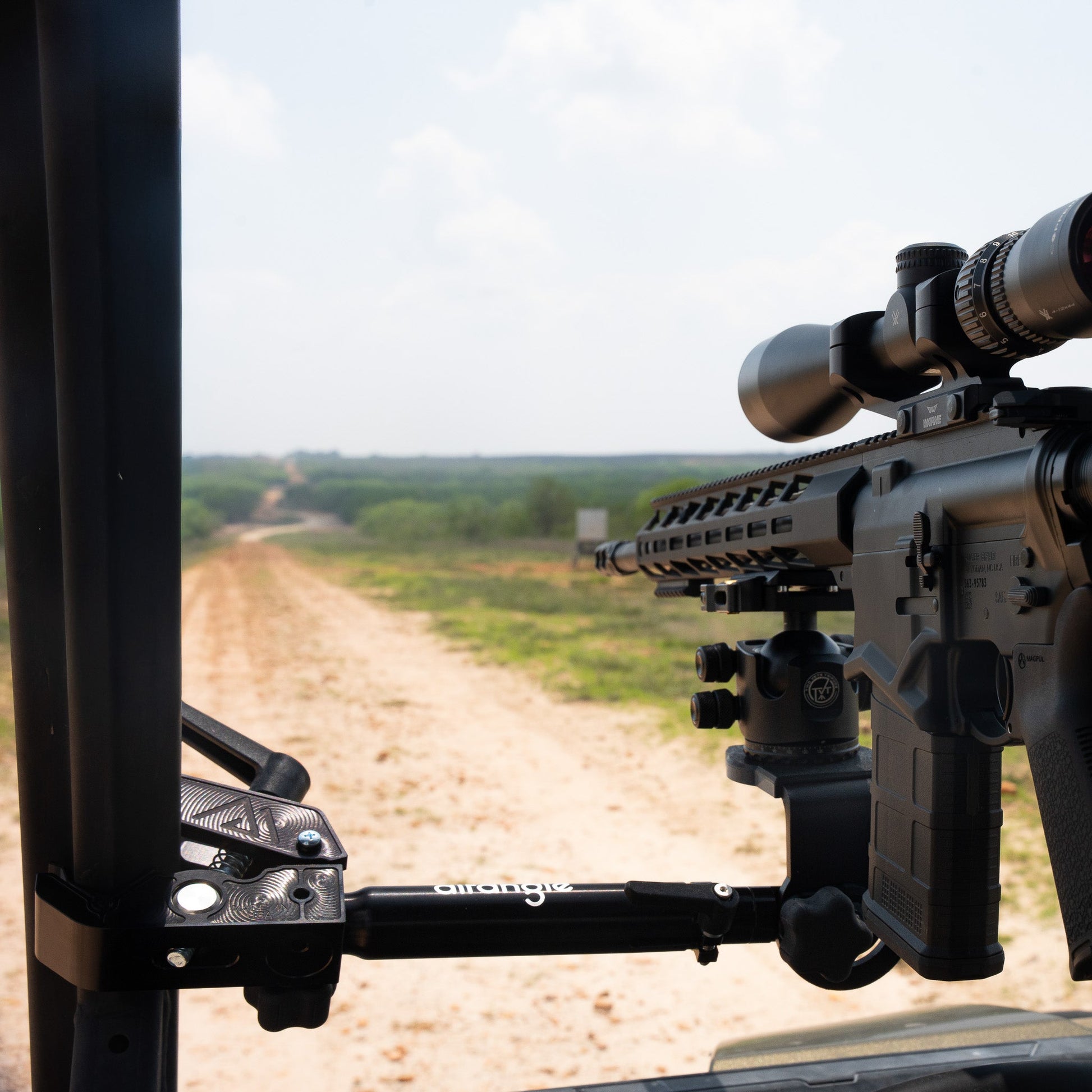 Connect Hub on a side-by-side roll cage providing a steady precision rest down a ranch road